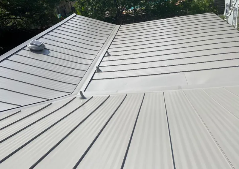 Solar attic fan installed on a metal roof for Roof Ventilation in Hobart